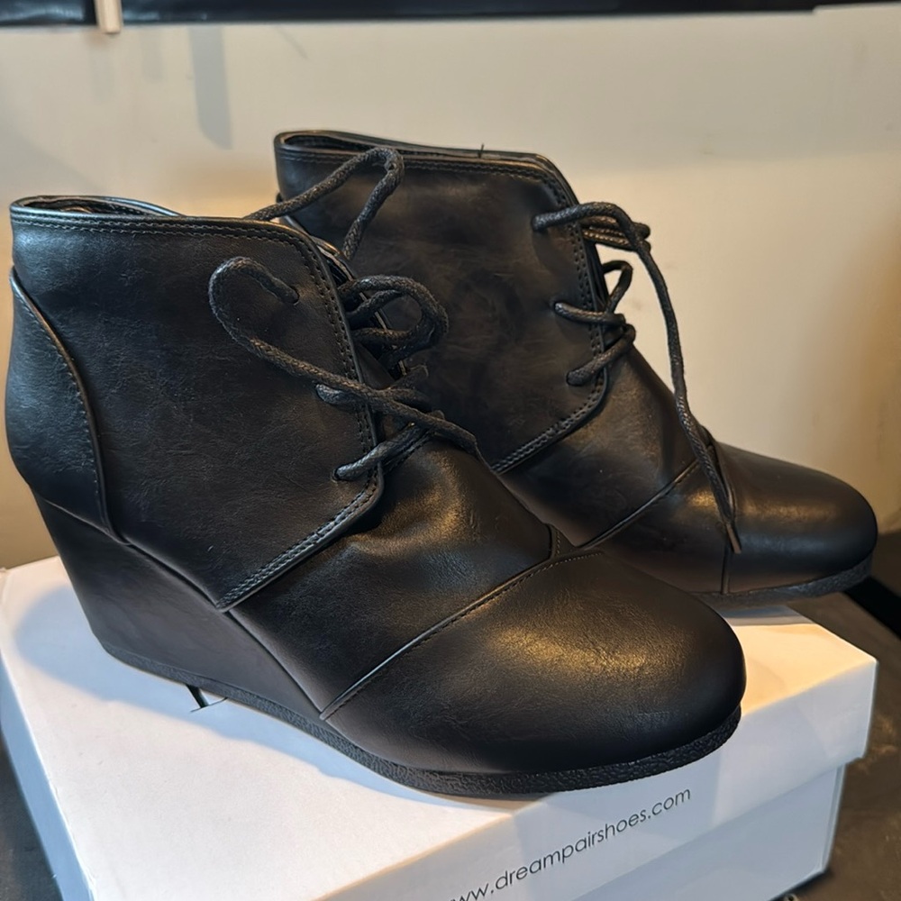 Black size 7 wedges. Brand new never worn